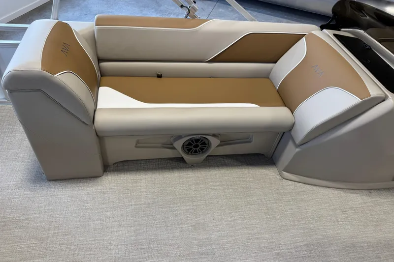 Slide: The Image of Luxurious seating in the 2026 Avalon Venture 85 ELW boat, featuring beige and brown upholstery. - 9