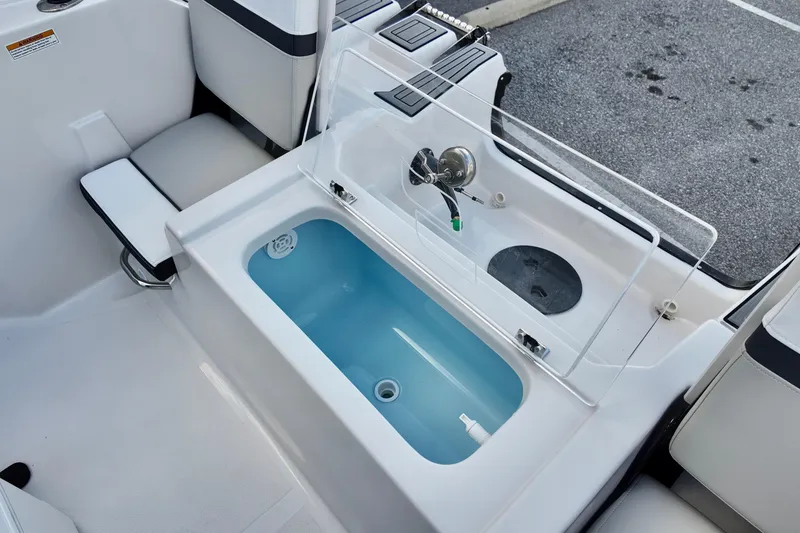Slide: The Image of 2026 Starcraft SVX 191 OB CC boat interior with livewell and seating. - 12