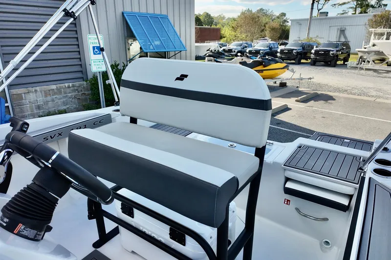 Slide: The Image of 2026 Starcraft SVX 191 OB CC boat interior with seating and steering wheel. - 14