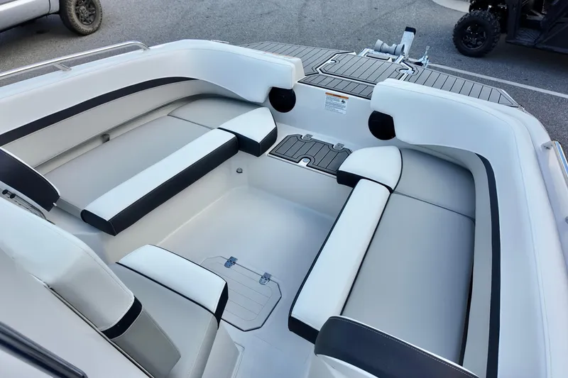 Slide: The Image of 2026 Starcraft SVX 191 OB CC boat interior with sleek white and black seating. - 17