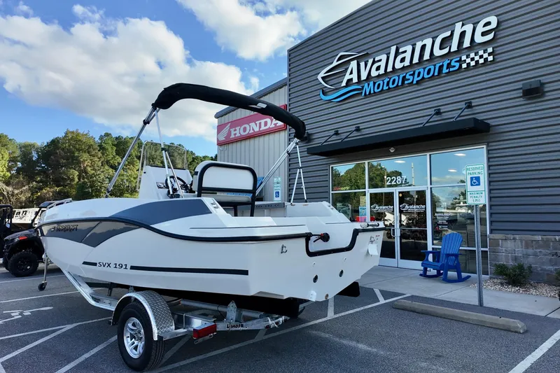 Slide: The Image of 2026 Starcraft SVX 191 OB CC boat on trailer at Avalanche Motorsports dealership. - 4