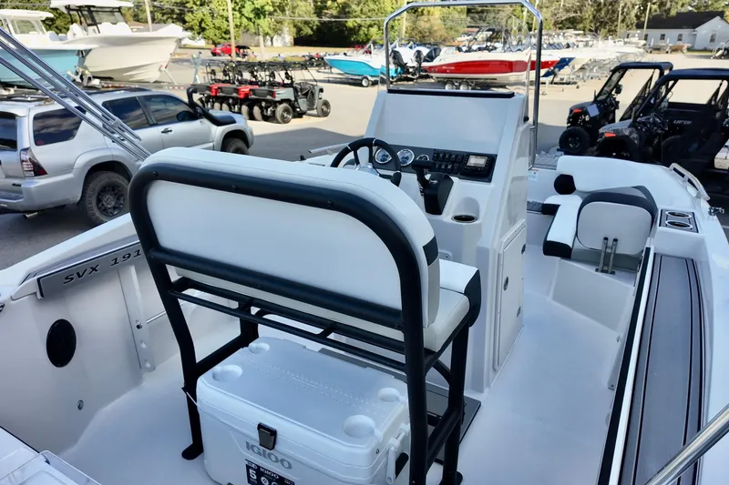 Slide: The Image of 2026 Starcraft SVX 191 OB CC boat interior with seating and control console. - 5