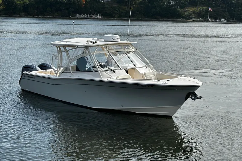 The Image of 2023 Grady-White Freedom 307 boat on calm water, showcasing sleek design and modern features. - 0