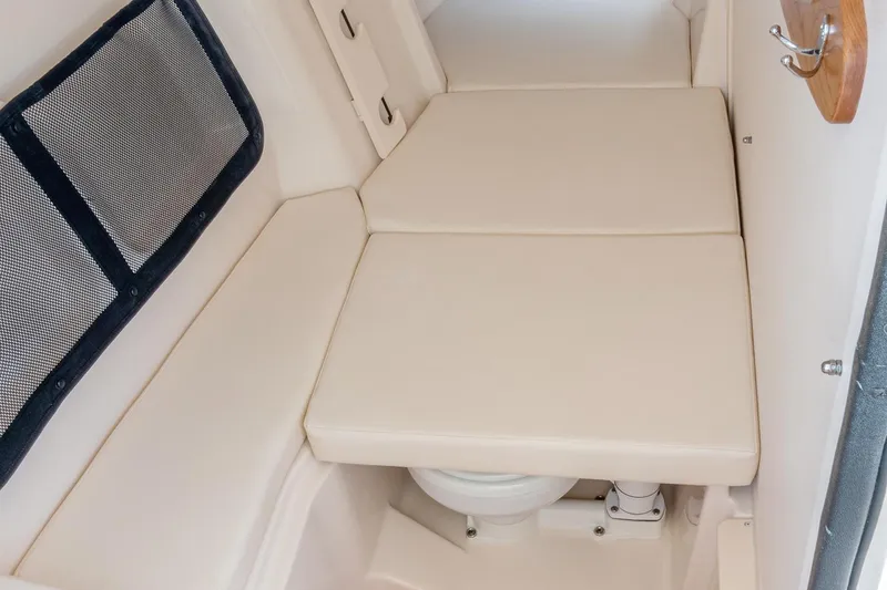 Slide: The Image of Manufacturer Provided Image: 2023 Grady-White Freedom 307 boat interior with cushioned seating and storage. - 23