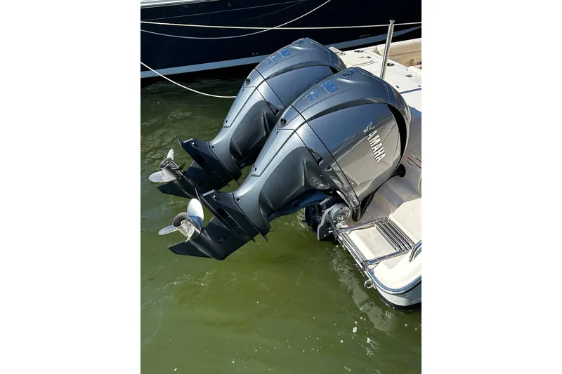 Slide: The Image of Twin Yamaha outboard engines on a 2023 Grady-White Freedom 307 boat. - 27