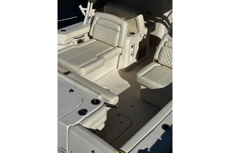 Slide: The Image of 2023 Grady-White Freedom 307 boat interior with luxurious seating and modern design. - 32