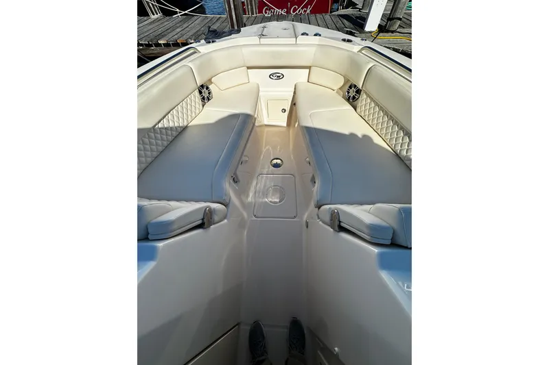 Slide: The Image of 2023 Grady-White Freedom 307 boat interior with cushioned seating and sleek design. - 34
