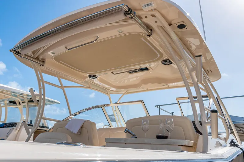 Slide: The Image of Throttle controls on a 2023 Grady-White Freedom 307 boat dashboard. - 7