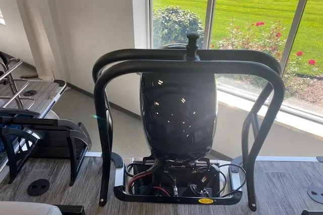 Slide: The Image of 2026 Bentley Pontoons Legacy 243 Navigator interior with engine view, showcasing modern design. - 10