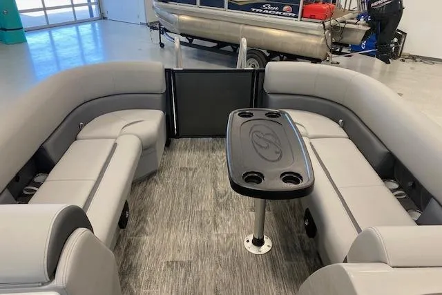 Slide: The Image of 2026 Bentley Pontoons Legacy 243 Navigator interior with gray seating and central table. - 7