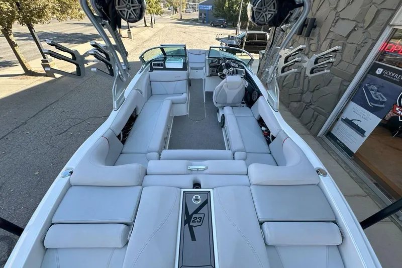Slide: The Image of 2017 MasterCraft X23 boat interior with spacious seating and modern design. - 14