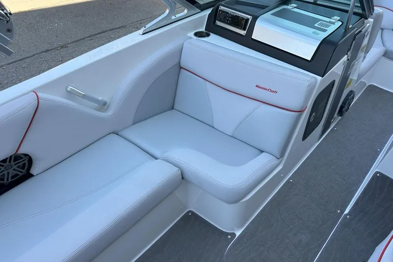 Slide: The Image of 2017 MasterCraft X23 boat interior with white seating and red accents. - 4