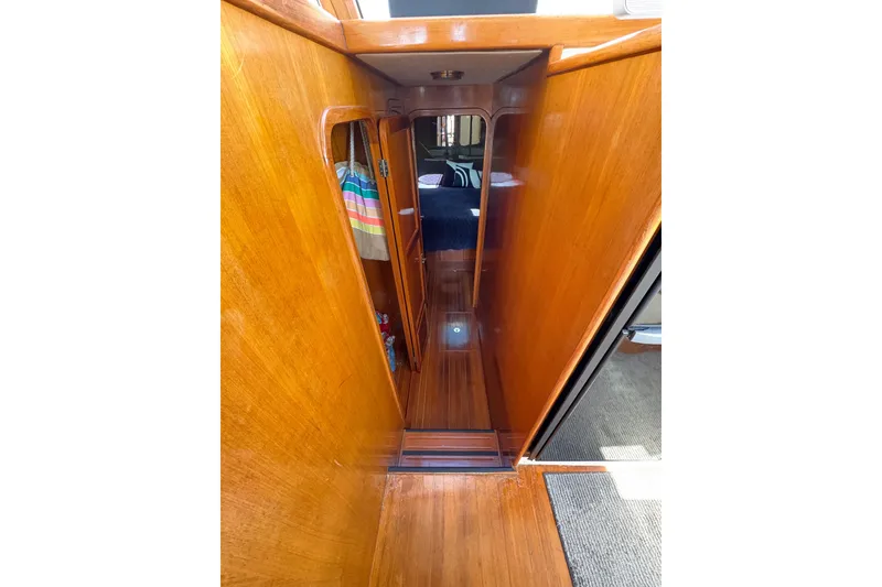 Slide: The Image of 1988 Ventare Sportfisher interior with polished wood finish and cozy cabin space. - 15