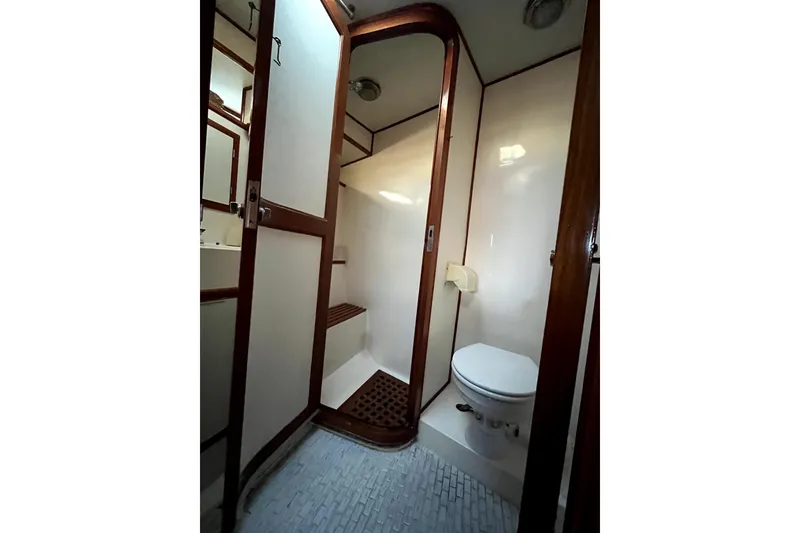 Slide: The Image of 1988 Vantare Sportfisher bathroom with wooden accents and compact design. - 18