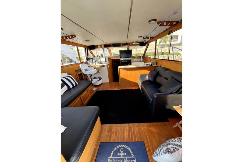 Slide: The Image of Interior of 1988 Vantare Sportfisher yacht with modern seating and navigation area. - 22