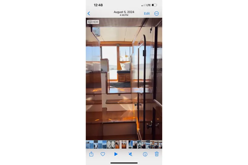 Slide: The Image of Interior view of a 1988 Vantare Sportfisher yacht, showcasing polished wood and modern design. - 36