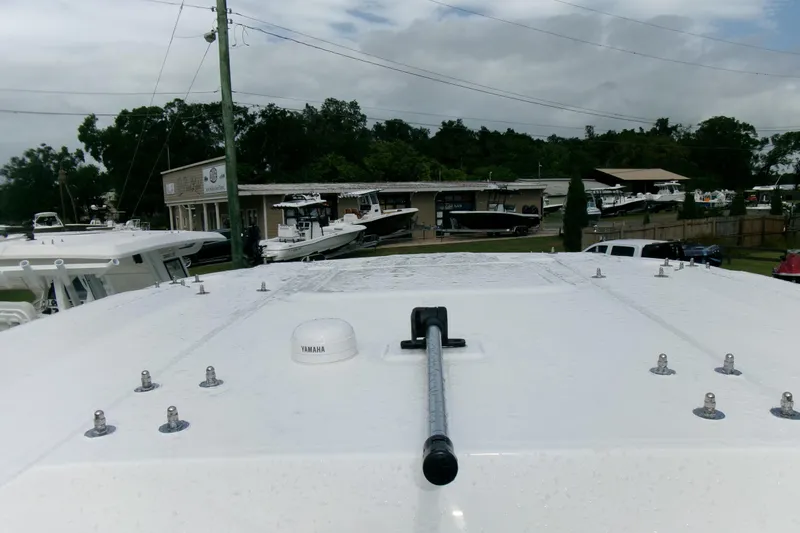 Slide: The Image of 2026 Sea Fox 288 Commander boat roof with Yamaha equipment, dealership in background. - 11