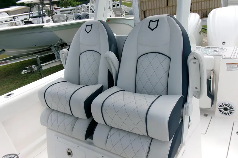 Slide: The Image of 2026 Sea Fox 288 Commander boat seats with diamond stitching and armrests. - 14