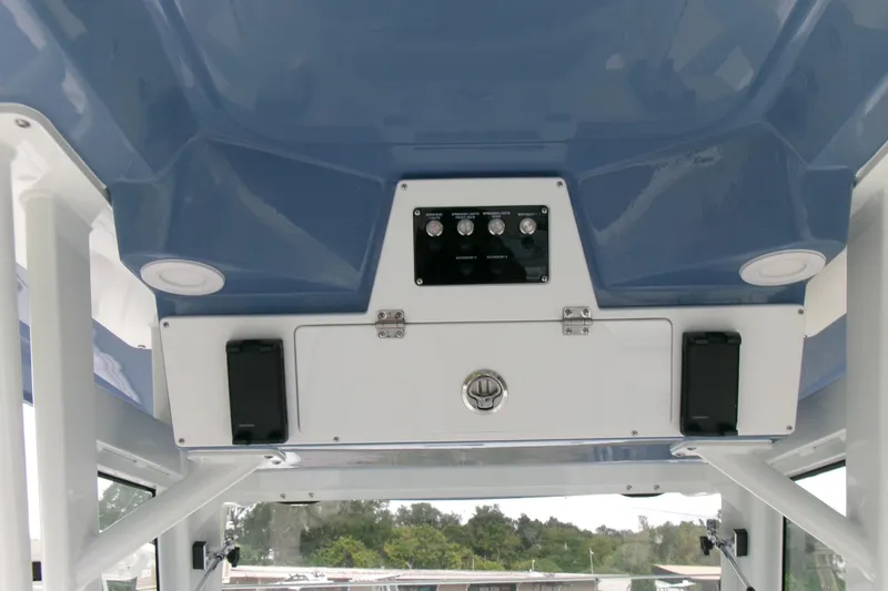 Slide: The Image of 2026 Sea Fox 288 Commander boat console with controls and storage compartments. - 15