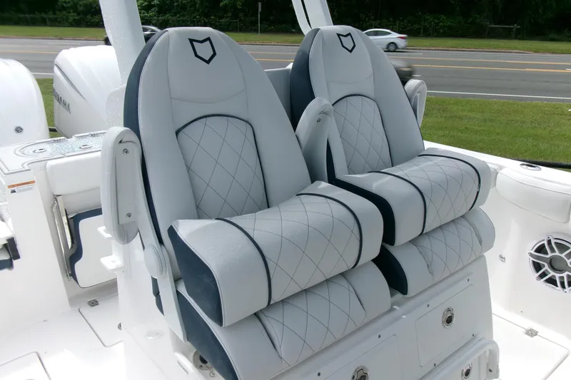 Slide: The Image of 2026 Sea Fox 288 Commander boat seats with diamond stitching and armrests. - 20