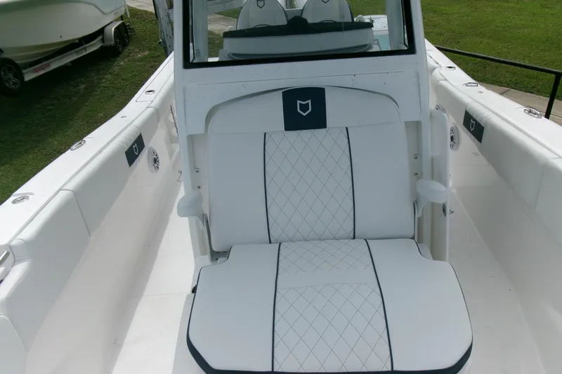 Slide: The Image of 2026 Sea Fox 288 Commander boat interior with white cushioned seating and sleek design. - 23
