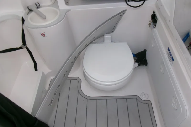Slide: The Image of 2026 Sea Fox 288 Commander boat bathroom with toilet and sink. - 24