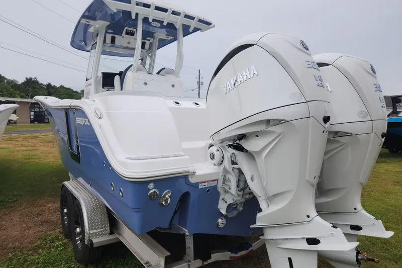 Slide: The Image of 2026 Sea Fox 288 Commander boat with dual Yamaha engines on a trailer. - 26