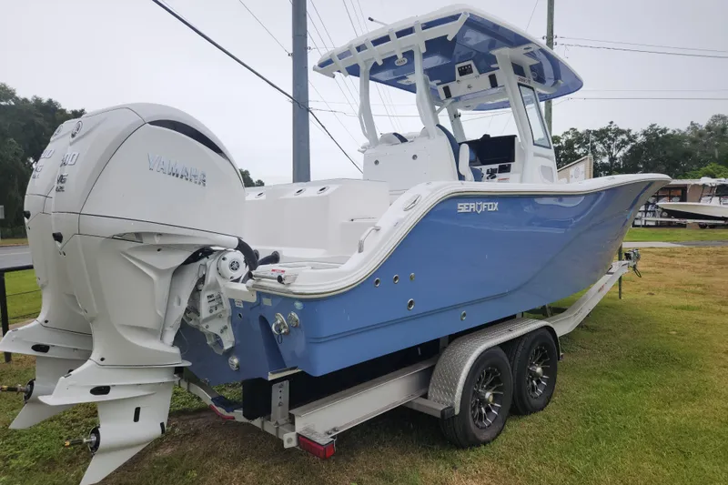 Slide: The Image of 2026 Sea Fox 288 Commander boat with Yamaha engines on a trailer. - 3