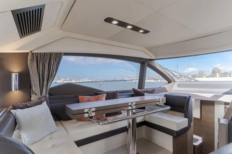 Slide: The Image of Luxurious interior of 2015 Azimut Fly 50 yacht with elegant seating and scenic window view. - 17