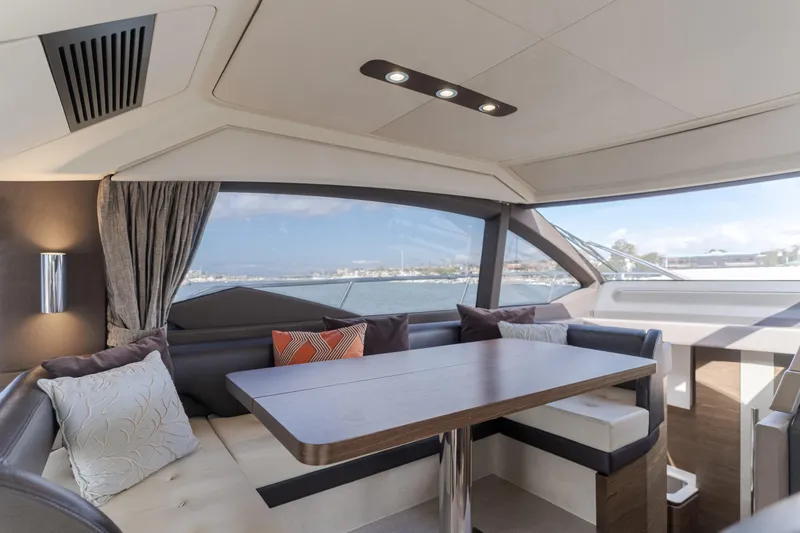 Slide: The Image of Luxurious interior of 2015 Azimut Fly 50 yacht with elegant seating and panoramic windows. - 18