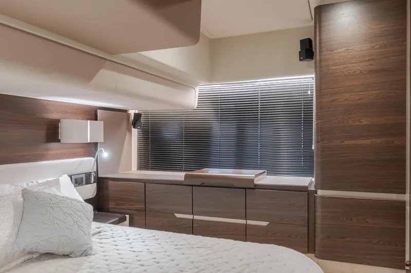 Slide: The Image of Luxurious interior of 2015 Azimut Fly 50 yacht with modern wood finishes and elegant bedding. - 24