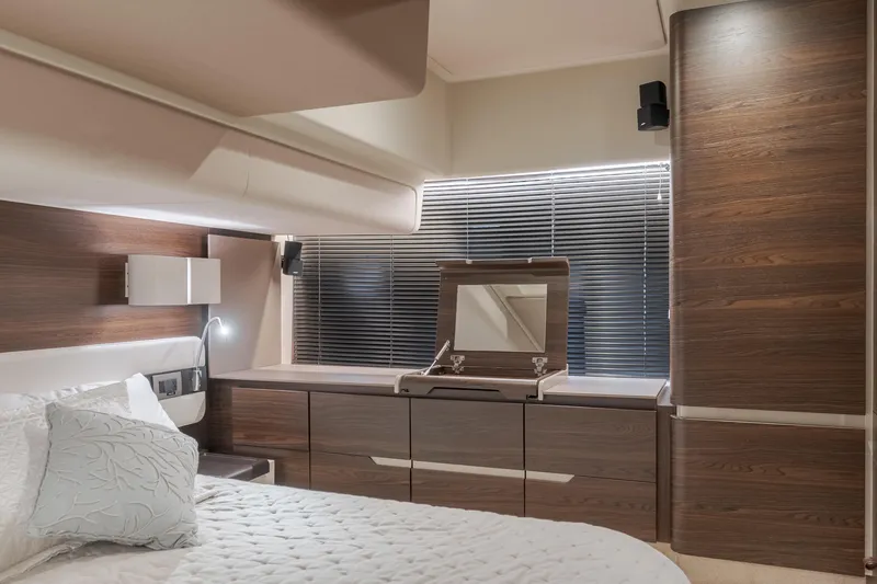 Slide: The Image of Luxurious bedroom interior of 2015 Azimut Fly 50 yacht with modern wood finishes. - 25