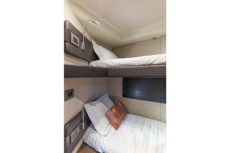 Slide: The Image of Bunk beds in 2015 Azimut Fly 50 yacht cabin, featuring modern design and cozy bedding. - 32