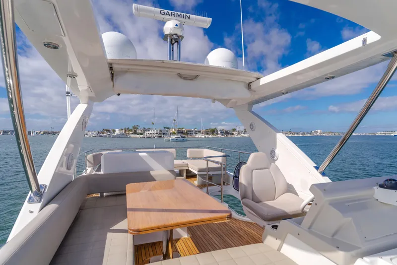 Slide: The Image of Luxurious 2015 Azimut Fly 50 yacht with spacious deck and seating, cruising on a sunny day. - 37