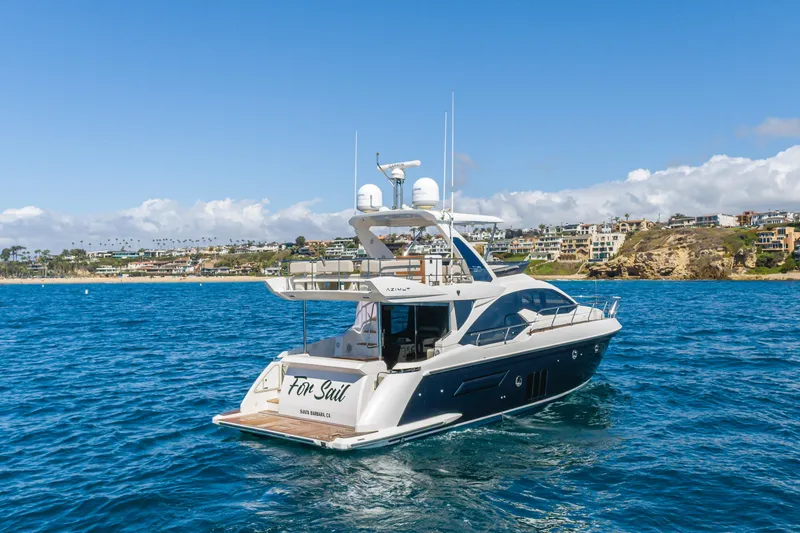 Slide: The Image of 2015 Azimut Fly 50 yacht on blue ocean near coastal homes. - 5