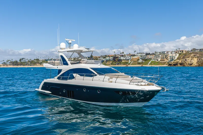 Slide: The Image of Luxurious 2015 Azimut Fly 50 yacht cruising near scenic coastline. - 6