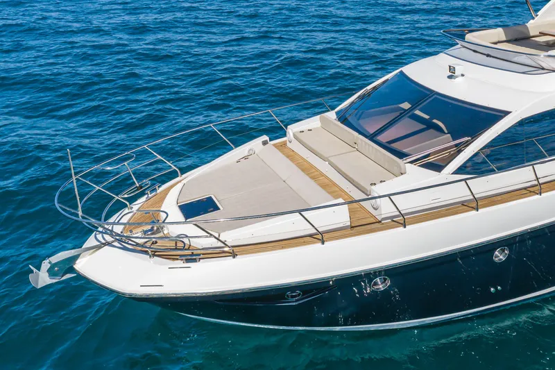Slide: The Image of Azimut Fly 50 yacht, 2015 model, cruising on clear blue water. - 8