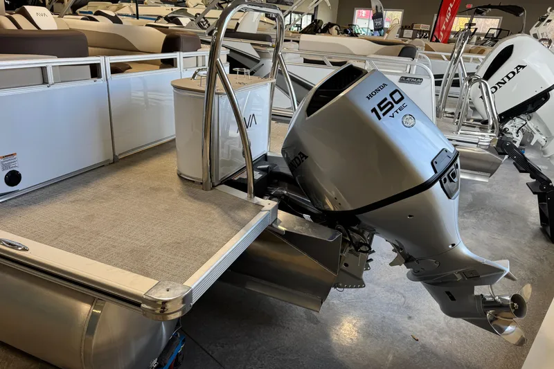 Slide: The Image of 2026 Avalon LSZ QL pontoon boat with Honda 150 VTEC outboard motor in showroom. - 15
