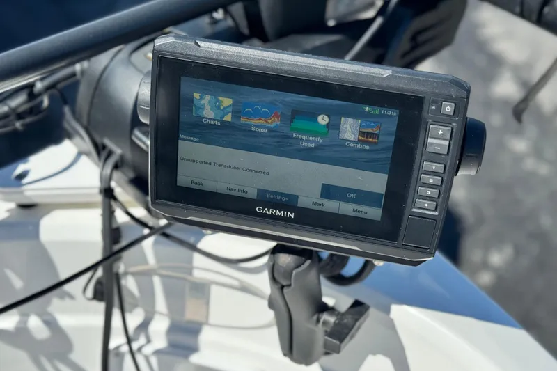 Slide: The Image of Garmin marine GPS device on 2020 Tahoe 500 TF boat, displaying charts and sonar options. - 15