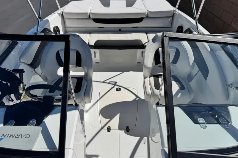 Slide: The Image of 2020 Tahoe 500 TF boat interior with seating and steering wheel, featuring Garmin equipment. - 16