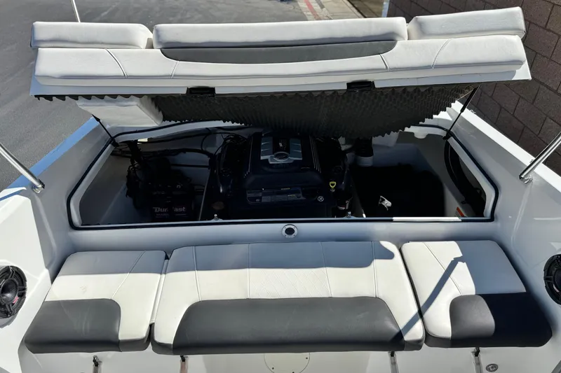 Slide: The Image of Open engine compartment of 2020 Tahoe 500 TF boat, showcasing interior components. - 18