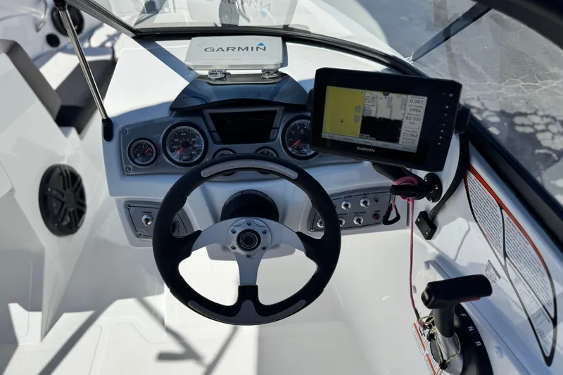 Slide: The Image of Steering console of 2020 Tahoe 500 TF boat with Garmin navigation system. - 26