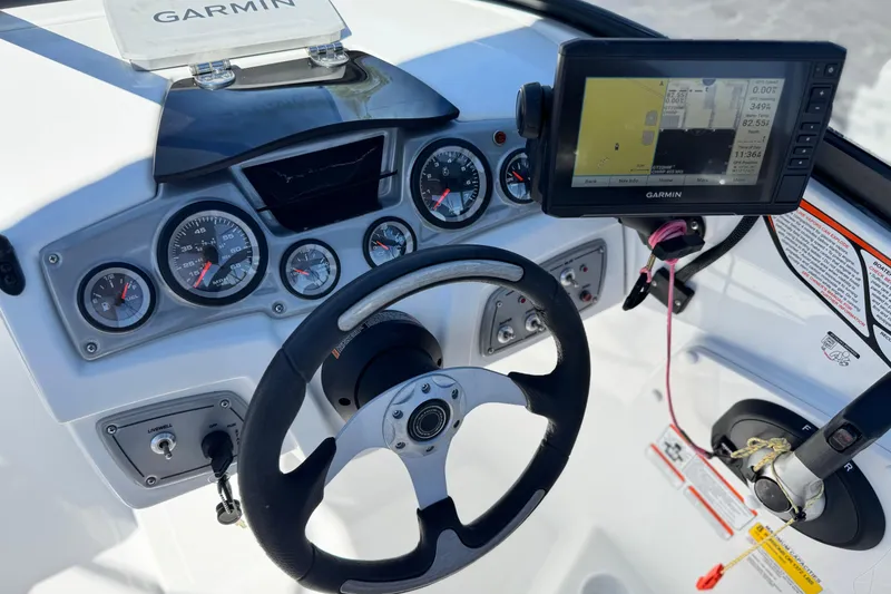 Slide: The Image of 2020 Tahoe 500 TF boat dashboard with Garmin GPS and control gauges. - 27