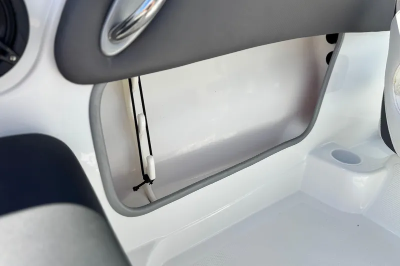 Slide: The Image of Interior storage compartment of a 2020 Tahoe 500 TF boat, featuring sleek design elements. - 28