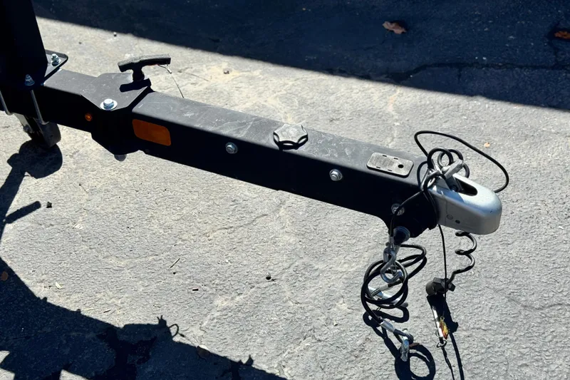 Slide: The Image of Trailer hitch of a 2020 Tahoe 500 TF on asphalt surface. - 30
