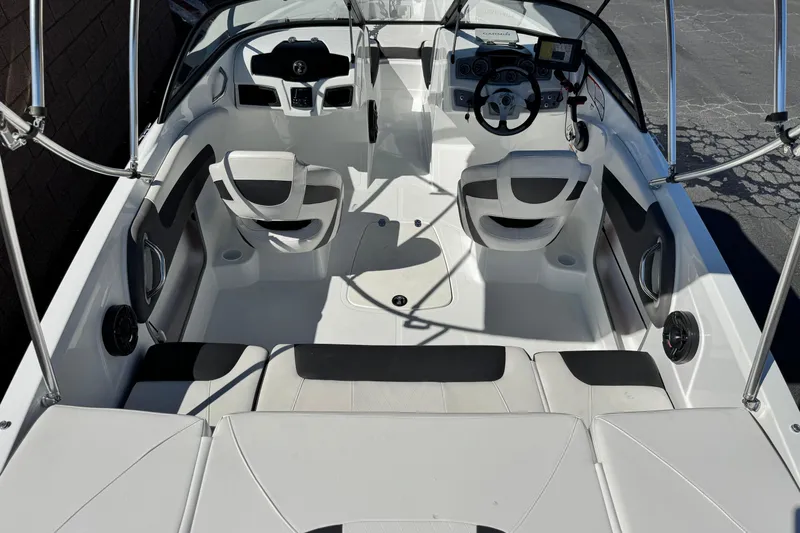 Slide: The Image of 2020 Tahoe 500 TF boat interior with seating, steering wheel, and dashboard controls. - 7