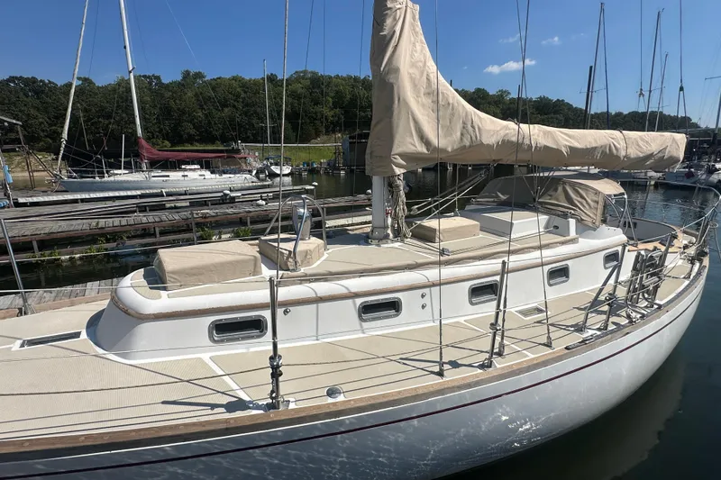Slide: The Image of Sailboat docked at marina, Mason 33 model, 1986, with covered sails. - 12