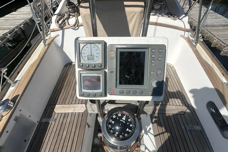 Slide: The Image of Cockpit of 1986 Mason 33 sailboat with navigation instruments and compass. - 16