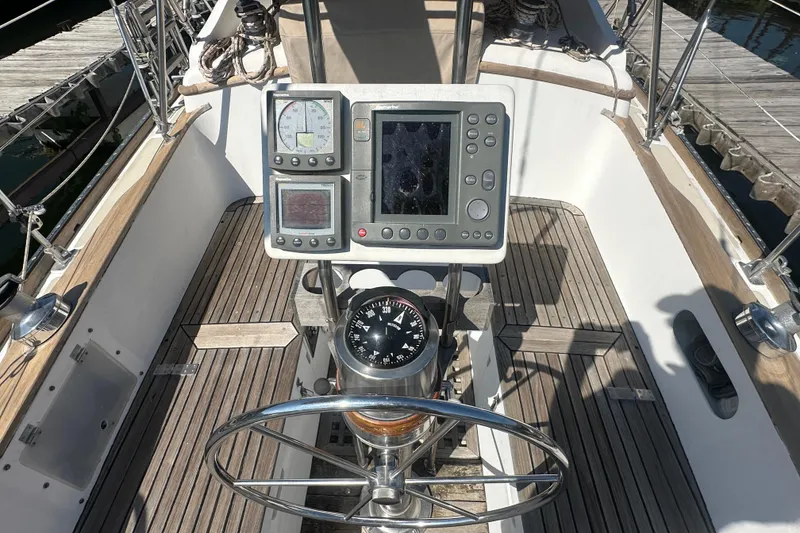 Slide: The Image of Cockpit of 1986 Mason 33 sailboat with navigation instruments and compass. - 17