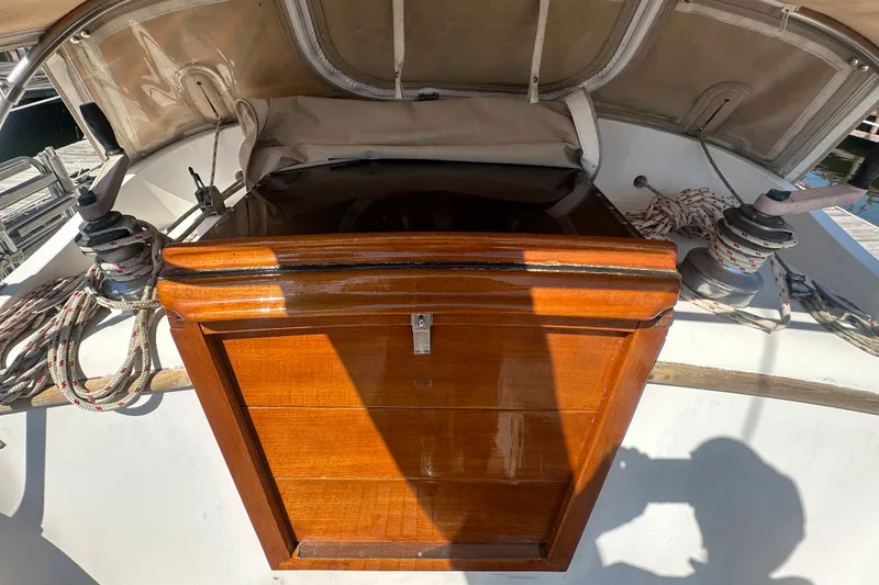 Slide: The Image of Wooden hatch on 1986 Mason 33 sailboat with ropes and winches. - 18